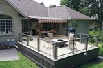 Aluminum Deck with railings and an awning